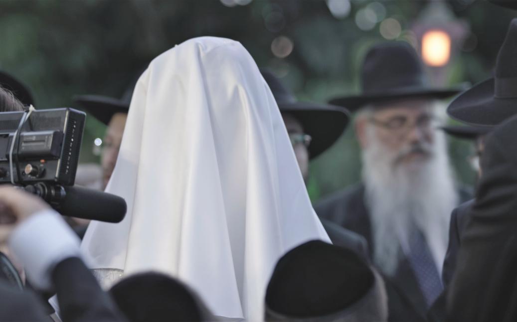 כ